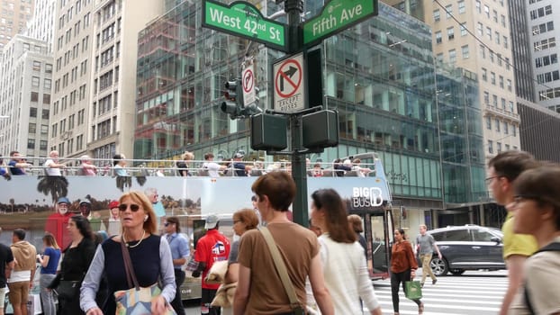 New York City, United States - 13 Sept 2023: Manhattan Midtown, Fifth 5 avenue 42 street intersection corner near Bryant Park, Library, Grand Central. Many people, american Big Bus tours double-decker