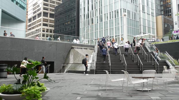New York City, United States - 11 Sept 2023: Manhattan Midtown office buildings, Lexington avenue, United States. People pedestrian exiting subway metro station, stairs on 53 street, USA urban life.