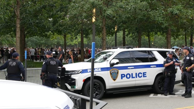 New York City, United States - 11 September 2023: Firefighters celebrate Patriot Day. Police cars, officers near 911 Memorial Pools. NYPD near Fire Department Station, Manhattan 10 Ten Firehouse, USA.