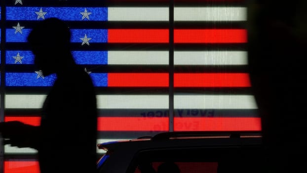 New York City, United States - 5 Sept 2023: Times Square, Manhattan Midtown Broadway street, USA. American flag, NYC urban life. Military island, army recruiting. People pedestrians silhouettes, crowd