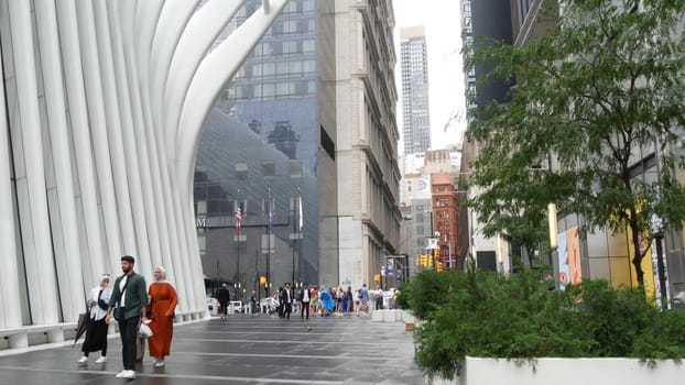 New York City, United States - 10 Sept 2023: Manhattan Downtown Financial District street. People near World Trade Center Oculus. USA architecture. Wildlife art sculpture, animals on bike installation