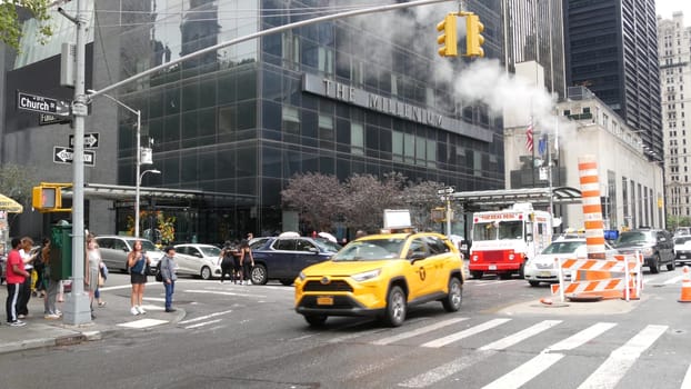 New York City, United States - 10 Sept 2023: Manhattan Downtown Church and Fulton street traffic, crossroad intersection zebra. Yellow taxi car. People near USA World Trade Center Oculus. Smoke stack.