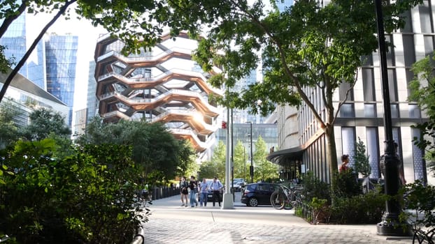 New York City, United States - 1 Sept 2023: Hudson Yards Vessel, urban architecture in Chelsea, Manhattan Midtown 34 street, USA. New modern glass skyscrapers, american business buildings, real estate