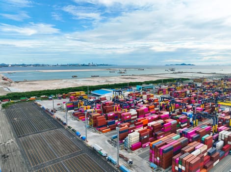 Logistics and transportation of container cargo ship at ship port. Container truck and crane bridge in shipyard. Import export and transport industry. Terminal port for export transport by ship.
