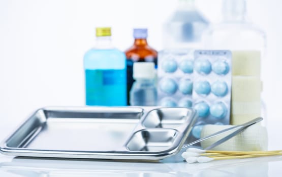 Medical equipment for treating infections. Wound care dressing set. Medical supplies for nurses. Conform bandage, forceps, cotton stick, alcohol. Sterile dressing materials. Healthcare equipment.