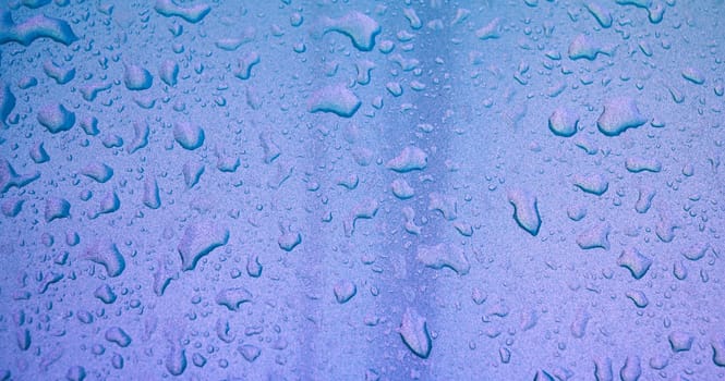 shiny pearl background with texture of rain drops on a metallic surface close-up