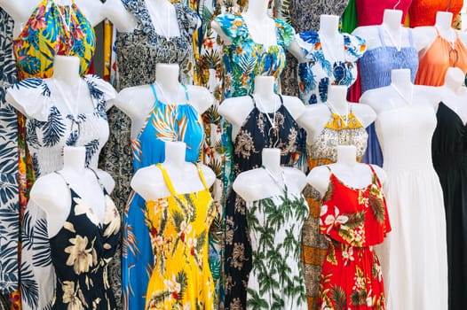 women's colorful summer dresses on mannequins are sold on the market in Asia