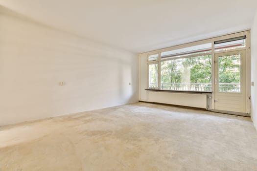 A spacious, empty interior showcasing large windows that invite natural light, creating a serene atmosphere perfect for customization.