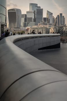 London, UK - Apr 27, 2025 - Perspective of skyscrapers in the business district of London before sunset. Architectural modern buildings of the city, View from The Scoop at More London, use it as your Wallpaper, Poster and Space for text, Selective focus.