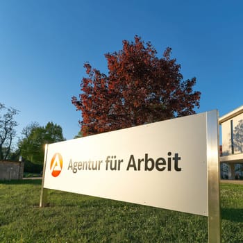 Magdeburg, Germany – April 26, 2025: Sign with the german inscription Agentur für Arbeit, employment agency in Magdeburg in Germany