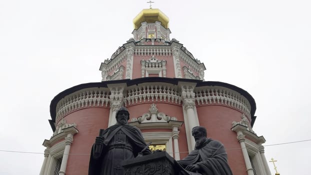 Low angle view of the monument to saints cyril and methodius with the bell tower of the smolensk cathedral in the background