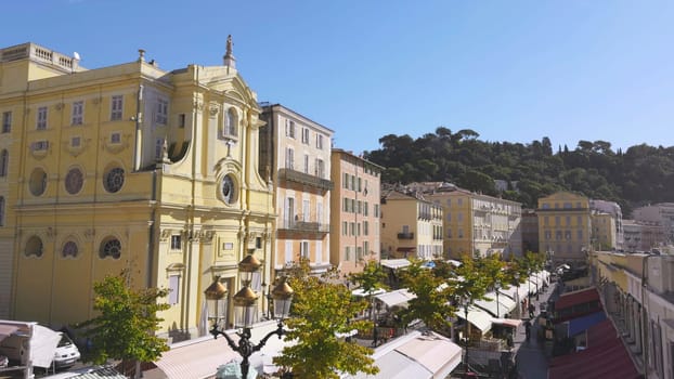 Cours saleya market with chapelle de la misericorde, a baroque style catholic church, in the old town of nice, france