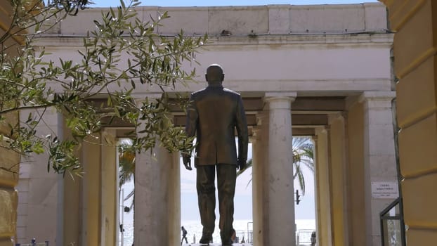 Bronze statue of sandro pertini, former president of italy, located in savona, liguria, italy, overlooking the sea