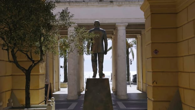 Bronze statue of sandro pertini, former president of italy, located in savona, liguria, italy, overlooking the sea