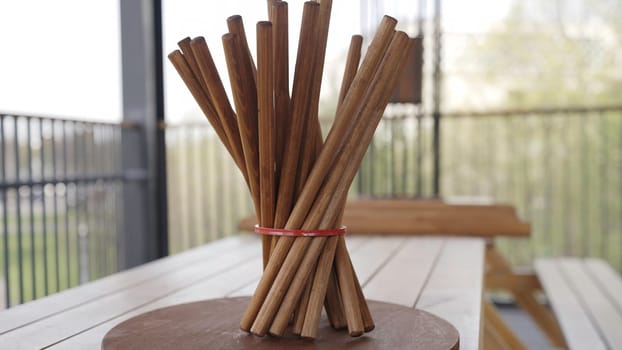 This video highlights an elegant arrangement of chopsticks on a wooden table, showcasing their design, texture, and cultural significance. Creative