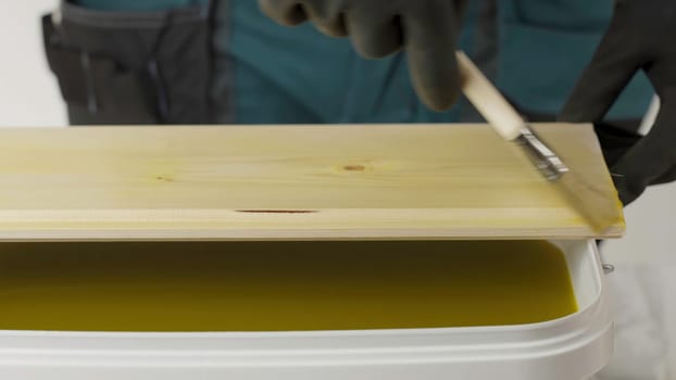 This is a demonstration showcasing how to apply a wood finish utilizing a brush, aimed at DIY enthusiasts. Creative