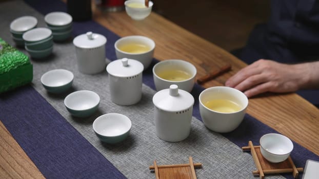Immerse yourself in the refined elegance of tea brewing with this wonderfully serene and tranquil tea ceremony scene. Media