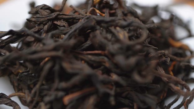 Closeup view of meticulously processed black tea leaves that are perfect for brewing a rich and aromatic beverage. Media