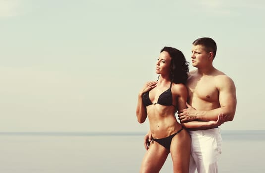 young caucasian couple at the sea side together