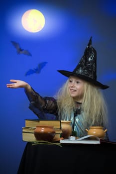 Girl dressed up as witch in night making magic