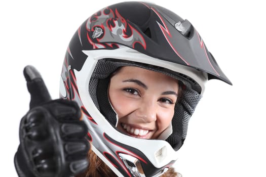 Happy biker woman with a motocross helmet and thumb up isolated on a white background