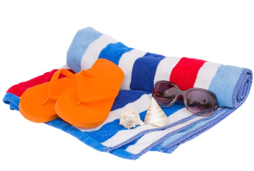 beach towel and sandals isolated on white background