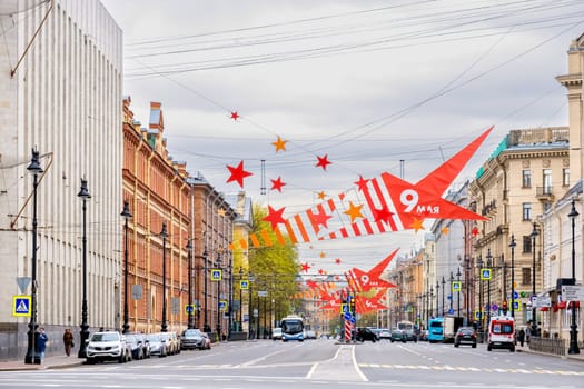 Saint-Petersburg, Russia - 05.05.2024. Urban street view with vibrant decorations showcasing Victory Day celebrations.