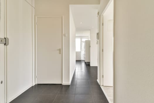 A sleek and modern interior hallway featuring clean lines, white walls, and a minimalist style. Ideal for contemporary home decor inspiration.