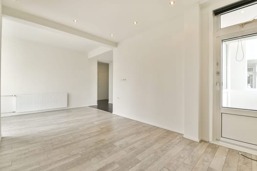 A bright, minimalist interior featuring sleek lines and neutral colors, showcasing an inviting and spacious environment perfect for contemporary living.
