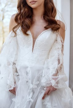 A serene bride sits gracefully, embodying elegance and purity. Her white gown and classic hairstyle highlight a timeless beauty. High quality photo