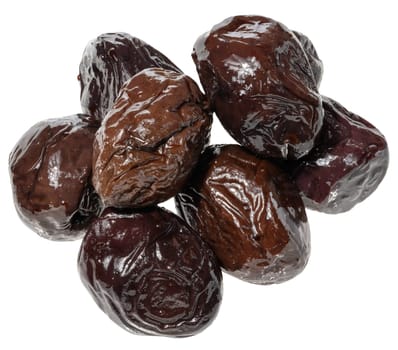 A pile of black pickled olives on an isolated background