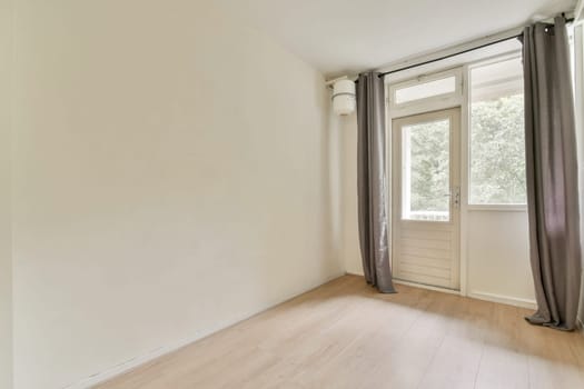 Bright and airy interior featuring a simple design and large windows that invite natural light, creating a serene ambiance perfect for relaxation.