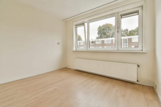 Bright and airy interior space featuring large windows, light wooden flooring, and a simple aesthetic. Ideal for creating a serene atmosphere.