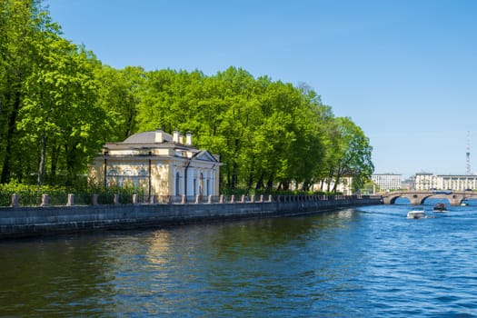 Saint-Petersburg, Russia - 05.21.24. Fontanka River with a pavilion surrounded by the greenery of the historic Summer Garden.