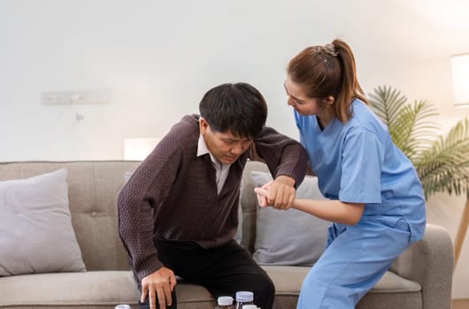 A caregiver helps an elderly man in a cozy home setting, showcasing compassion and support in daily living.