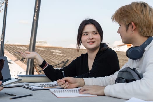 Teenagers gather after school to study and collaborate on assignments, fostering teamwork and learning in a casual environment.