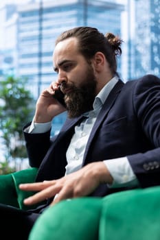 General director finalizing an agreement with investors group over phone call, balancing corporate responsibilities and strategic planning. Ensuring sustainable growth and business success.