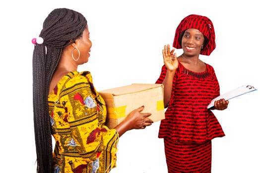 Adult business woman receiving a cardboard box of a woman dressed in red loincloth saying goodbye smiling with the help of a document