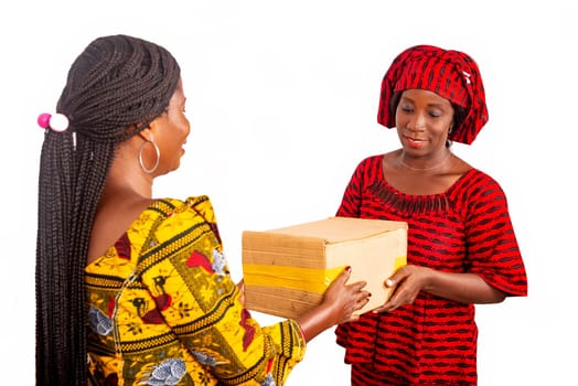 Adult business woman receiving a cardboard box of a woman dressed in red loincloth smiling