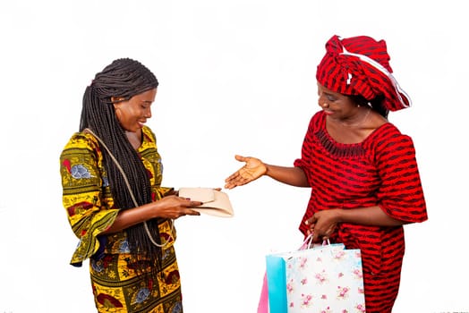 african delivery specialist wearing a red loincloth with paper bag holding out his hand while the business client looking at his handbag