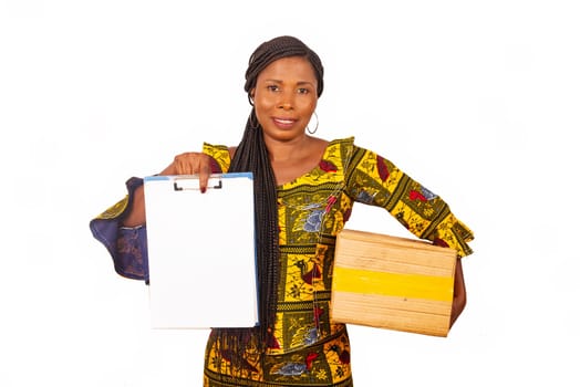 beautiful mature woman in traditional clothes standing on white background carrying a delivery package and document smiling.