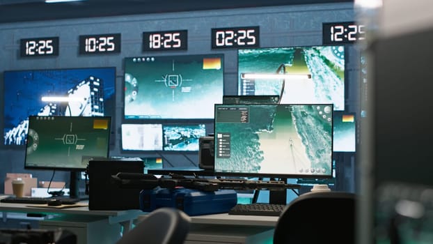 Secure room in army governmental facility operating as military command post and surveillance monitoring center, filled with digital equipment. Empty military base of operations with radar systems