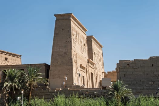 Side view of the reconstructed Philae Temple on an island in Aswan Harbor or Reservoir formed by the Low Dam on the Nile