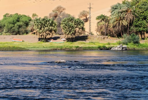 Granite rocks in the fast flowing water of the River Nile near Aswan Egypt