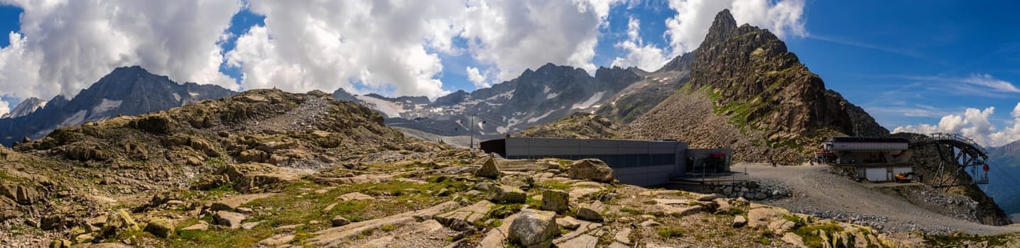 Passo Tonale, Italy - 10.08.2024: Majestic mountain panorama with rocky terrain.