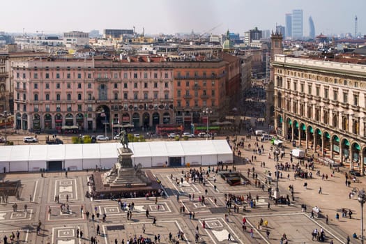 Milan, Italy - 19.03.2024: Urban landscape of Milan with historic buildings and city square, Milan Duomo Cathedral.