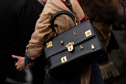 Paris, France - January, 22, 2024: woman wears Schiaparelli large secret Bijoux bag, fashion blogger outfit details, street style.
