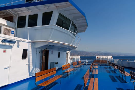 Sicily, Italy - 27.07.2024: Scenic deck view on passenger ferry crossing blue ocean.