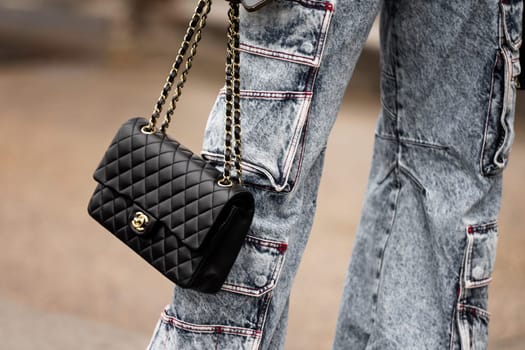 Paris, France - January, 24, 2024: woman wears Chanel bag, street style details, fashion outfit detail.
