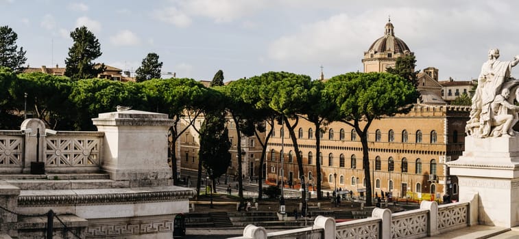 Rome, Italy - 09.12.2022: Historic roman architecture in Piazza del Campidoglio with panoramic view and classical statues in a cityscape.